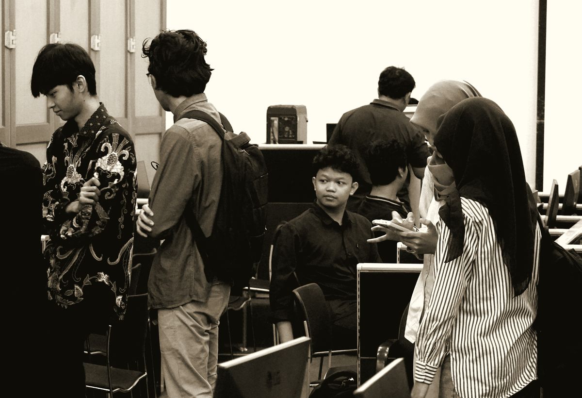 Participants clustered together mid-conversation during the build